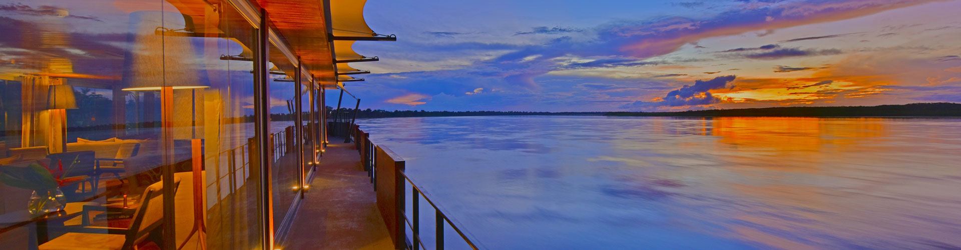 Covered promenade deck of a river ship at sunset